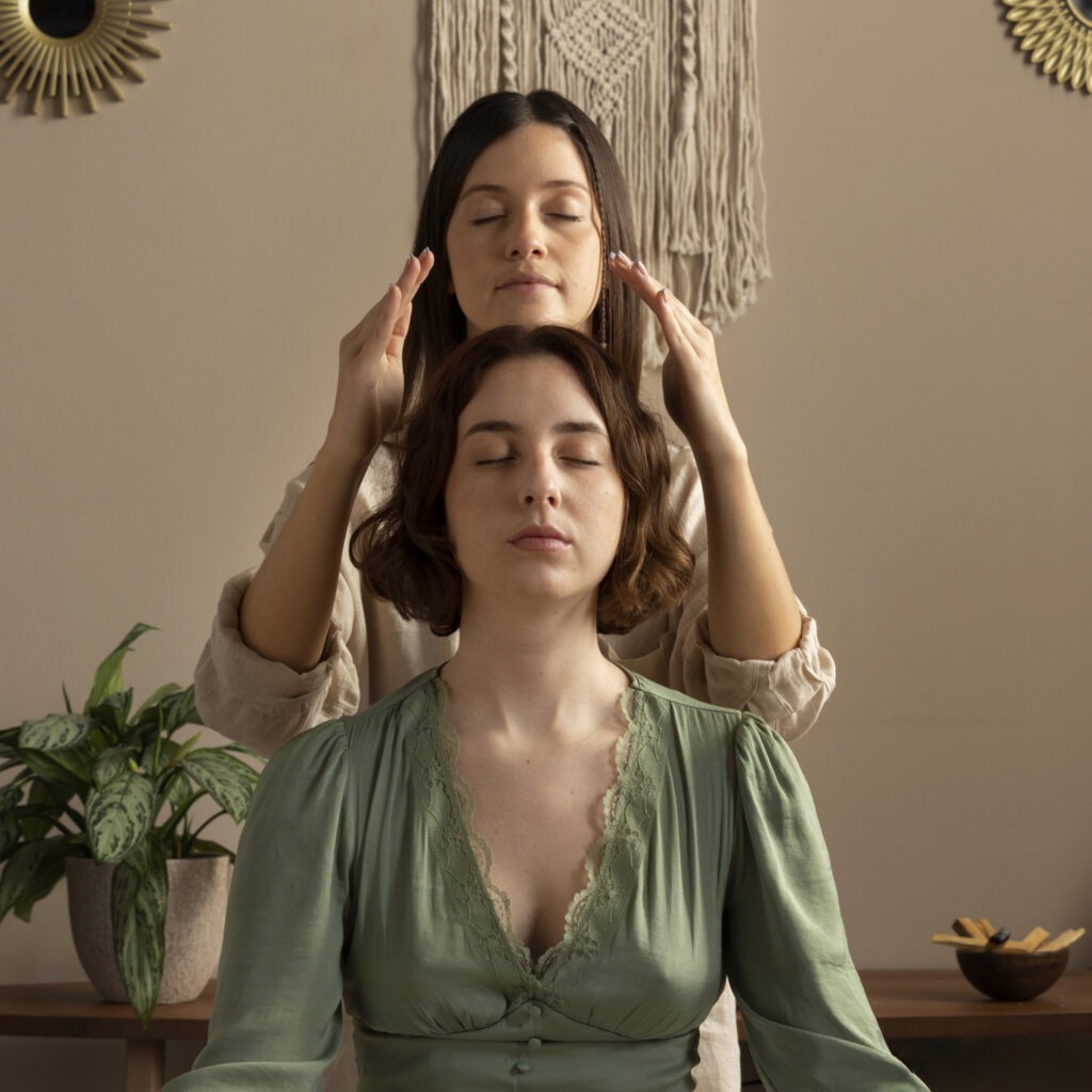 person conducting reiki therapy